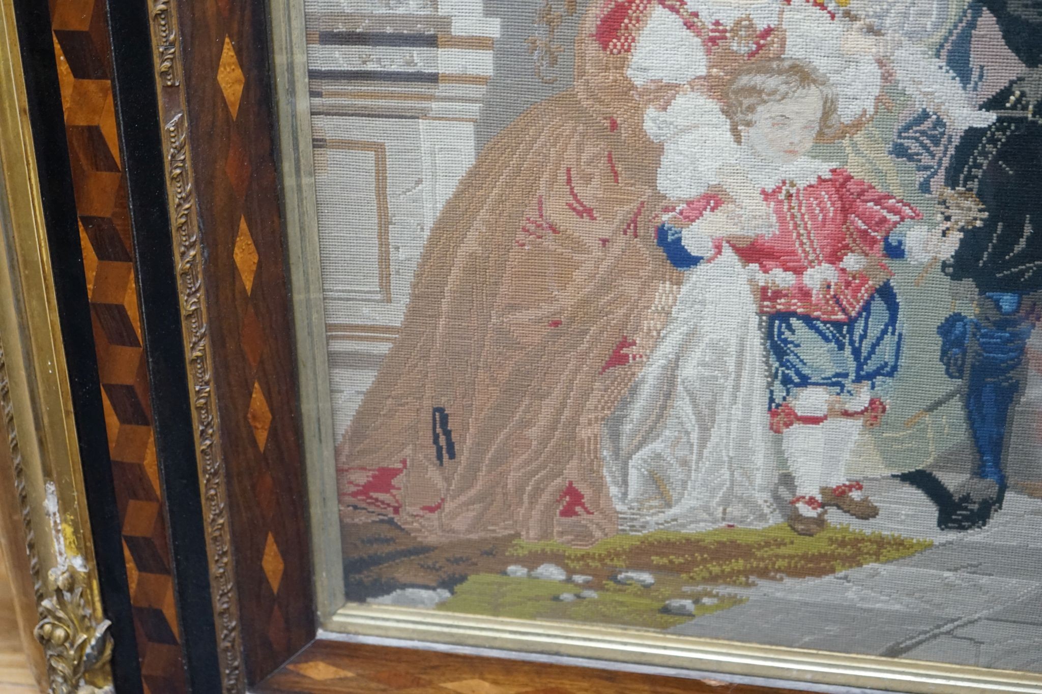 A 19th century Berlin tapestry panel in cubed parquetry and gilt gesso frame, width 146cm, height 120cm